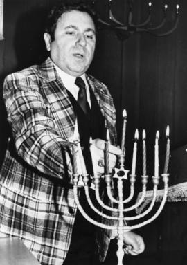 Man with menorah, St. Jacob's Synagogue