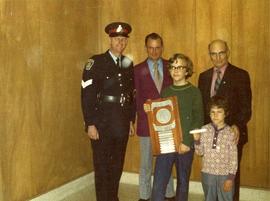 Two Parkdale Elementary students, hold the Kiwanis "Elmer" Safety Shield and Gold Bar.